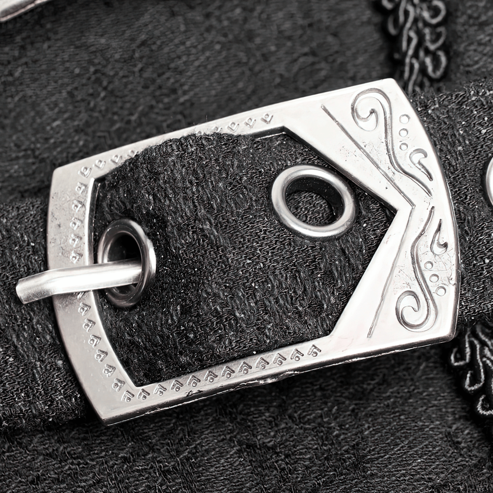 Close-up of ornate metal buckle on a dark Victorian lace-up skirt, adding a gothic touch to the design.