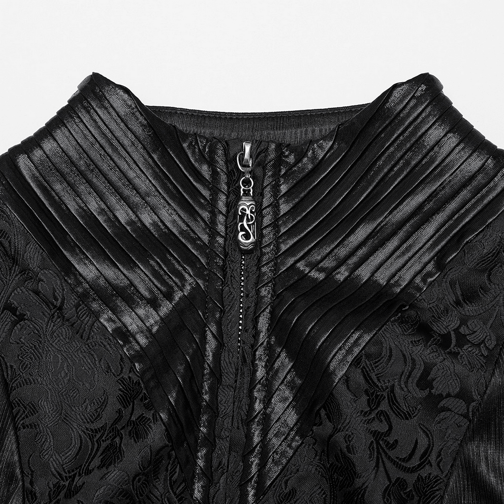 Close-up of black goth hooded witch coat with intricate 3D pleats and textured jacquard fabric detailing at the collar.