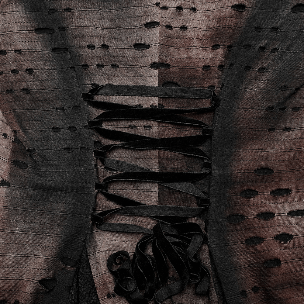 Close-up of dark wizard robe showing velvet corset-style lacing and intricate fabric details.