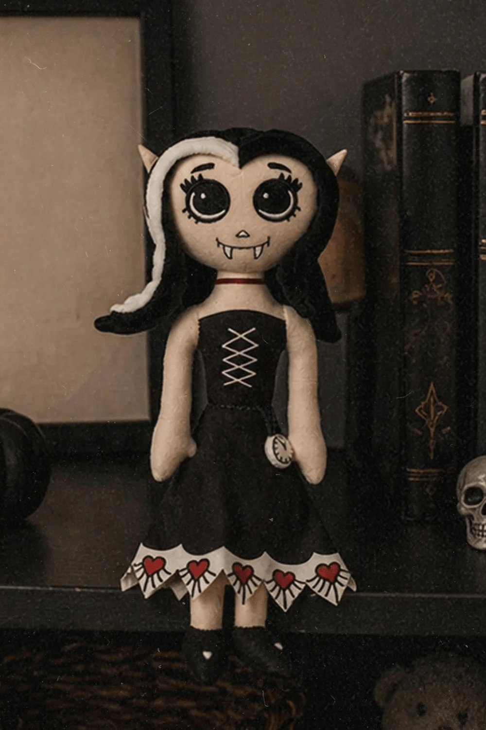 Dead Under The Bed Vampire Plush Doll Keepsake on a shelf with spooky decorations.