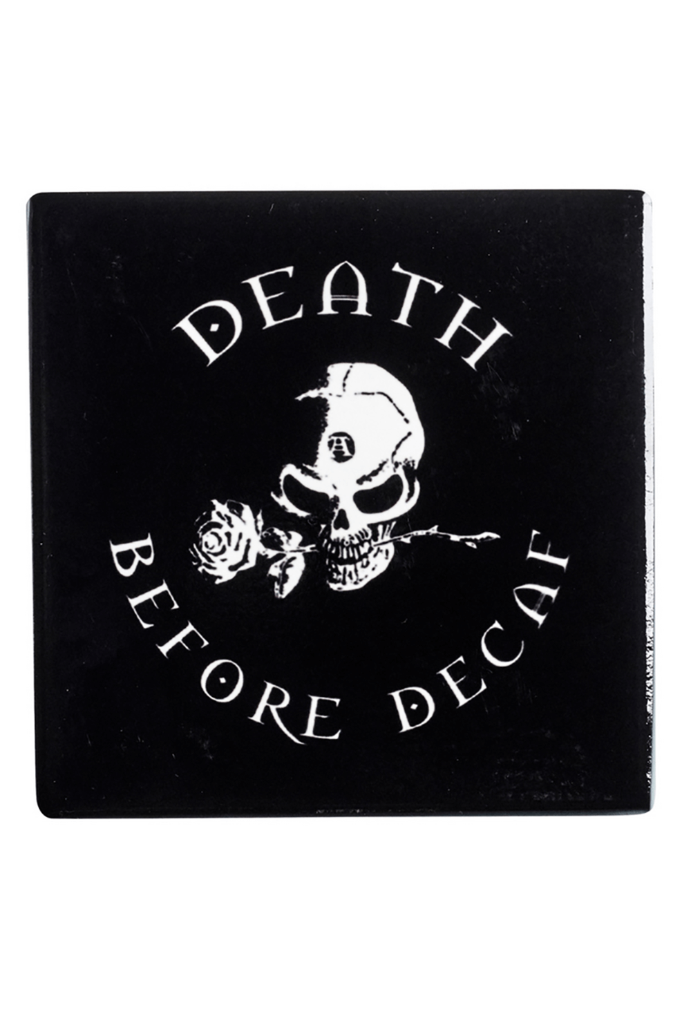 Black coaster featuring skull and rose design with 'Death Before Decaf' quote, perfect for coffee lovers.