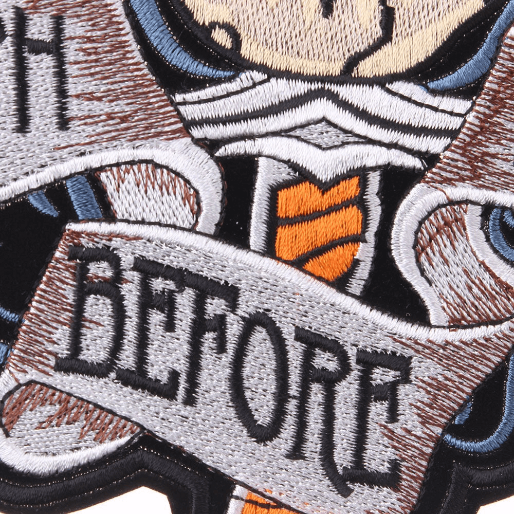 Close-up of Death Before Dishonor embroidered patch with skull and wings design, perfect for biker jackets.