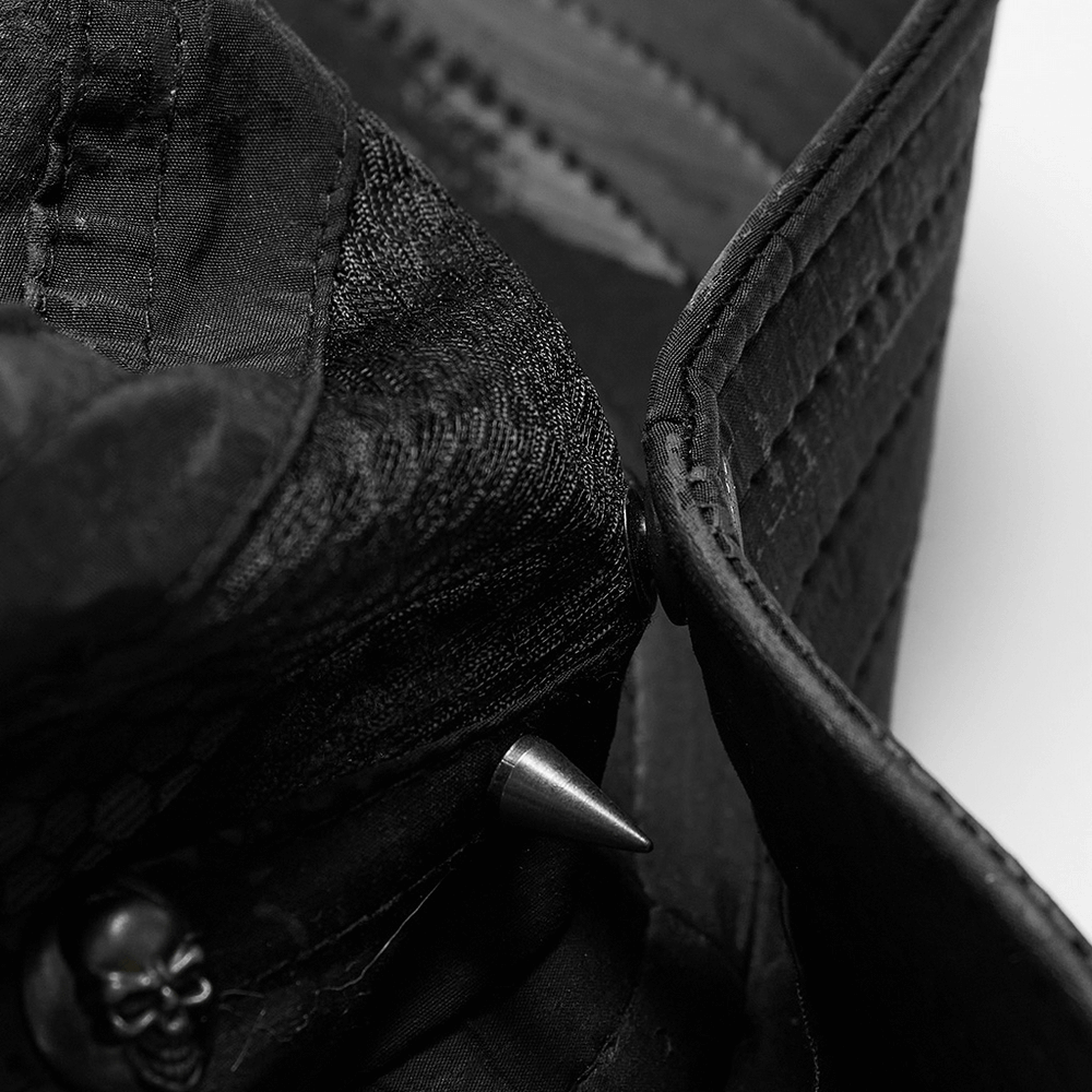 Close-up of the inner detail of a distressed woven hat featuring skull accents and adjustable brim.