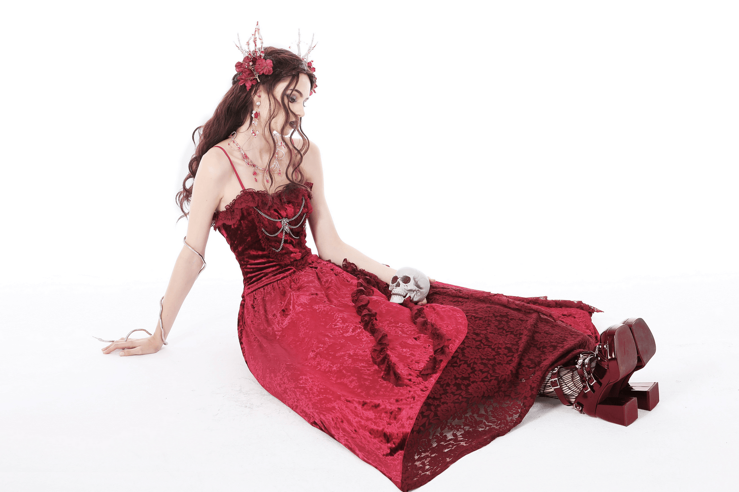Gothic Victorian deep red velvet maxi dress with cross bodice detail, showcasing dark elegance and romantic allure.