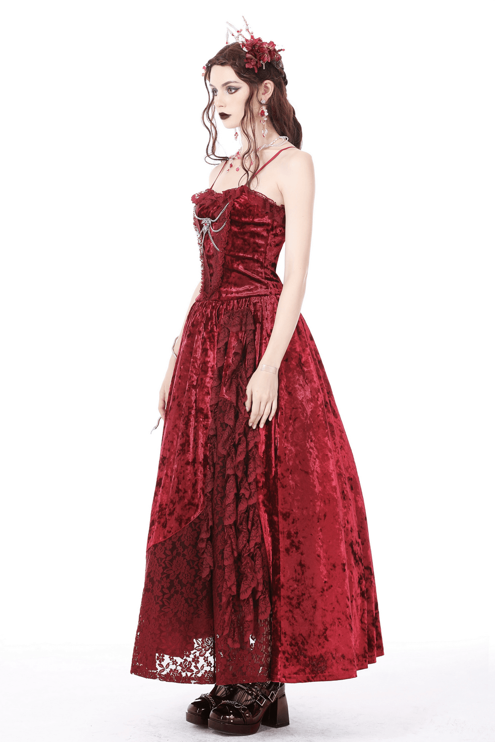 Deep red velvet maxi dress featuring dramatic cross bodice detail; perfect for gothic elegance and formal occasions.