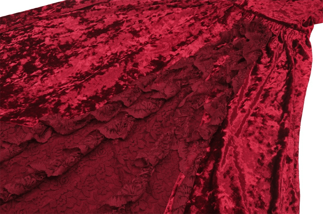 Luxurious deep red velvet fabric showcasing intricate texture and flow of a gothic maxi dress.