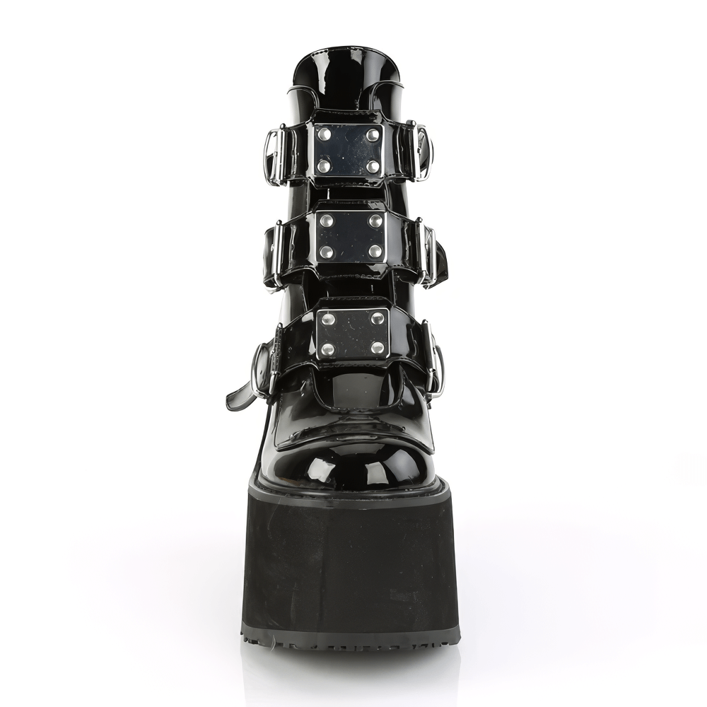 Gothic style black patent leather ankle boot with triple buckles and chrome plates, featuring a high wedge platform.
