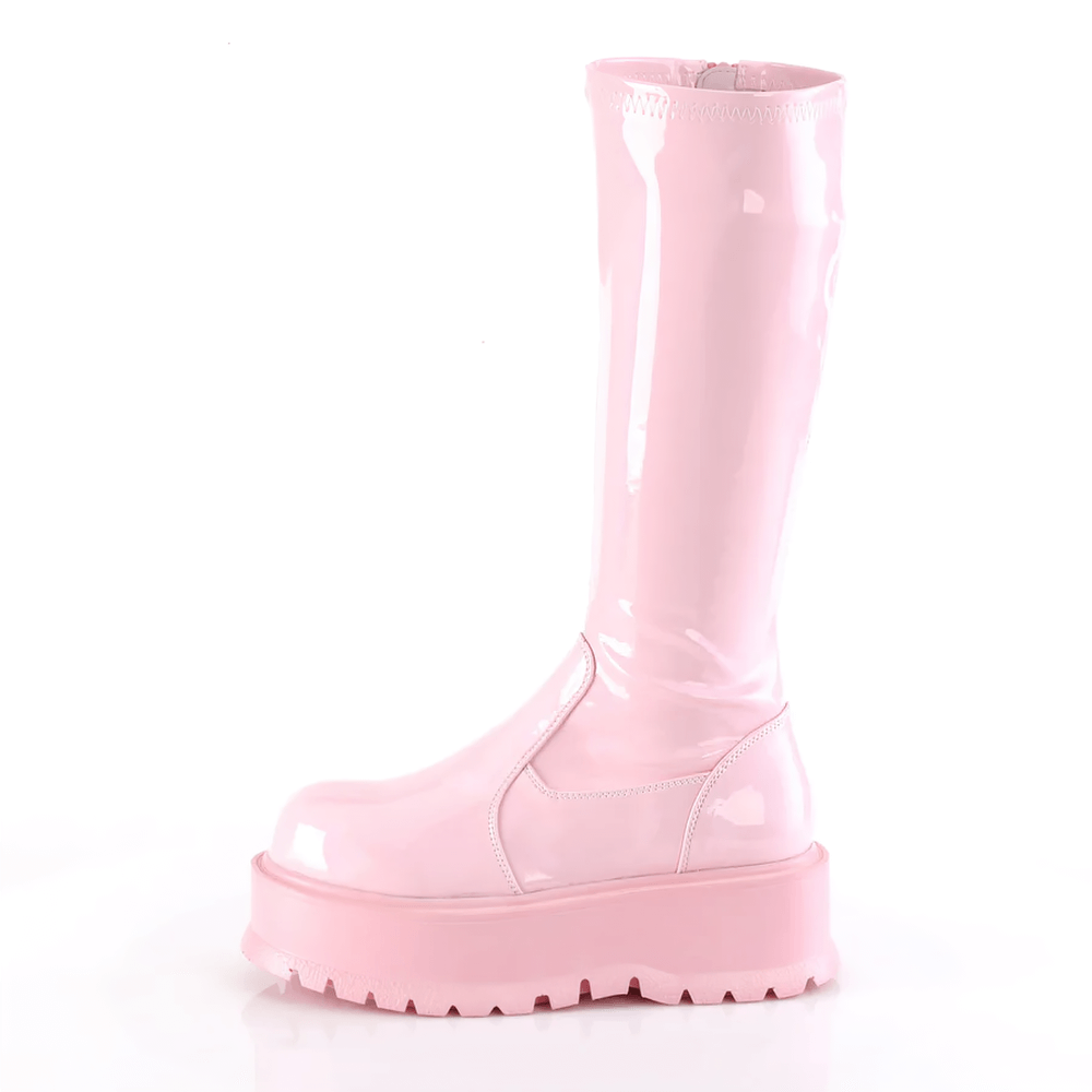 Baby pink holographic knee-high platform boots with a 2" sole and inside zip, perfect for festival vibes.