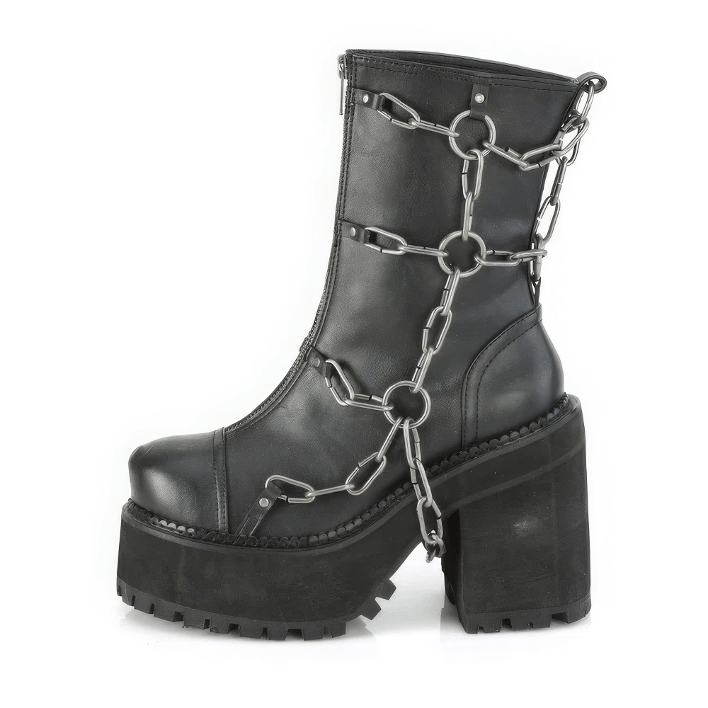 Bold black Demonia ankle boots featuring metal chain details and a high block heel for a rebellious style.