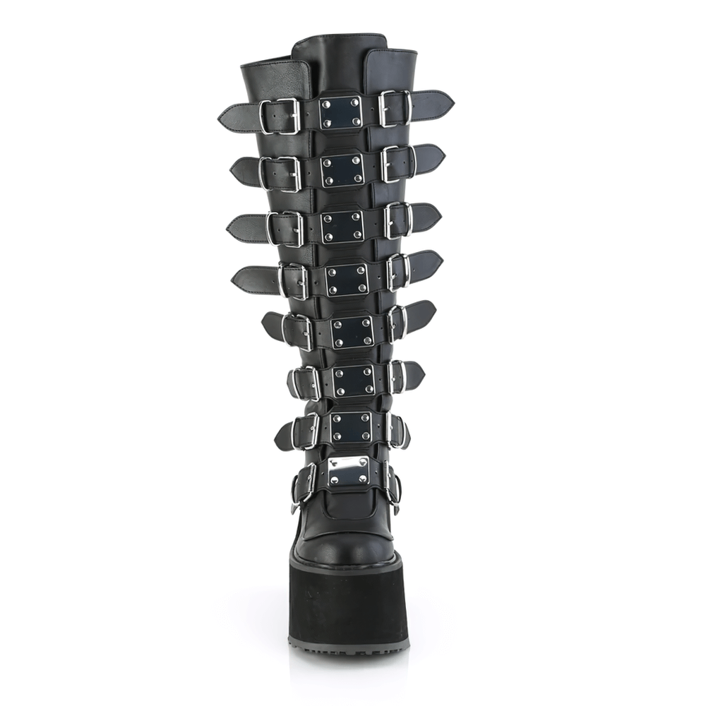 Demonia black buckled knee-high platform boots featuring robust straps and metal plates for a bold style.