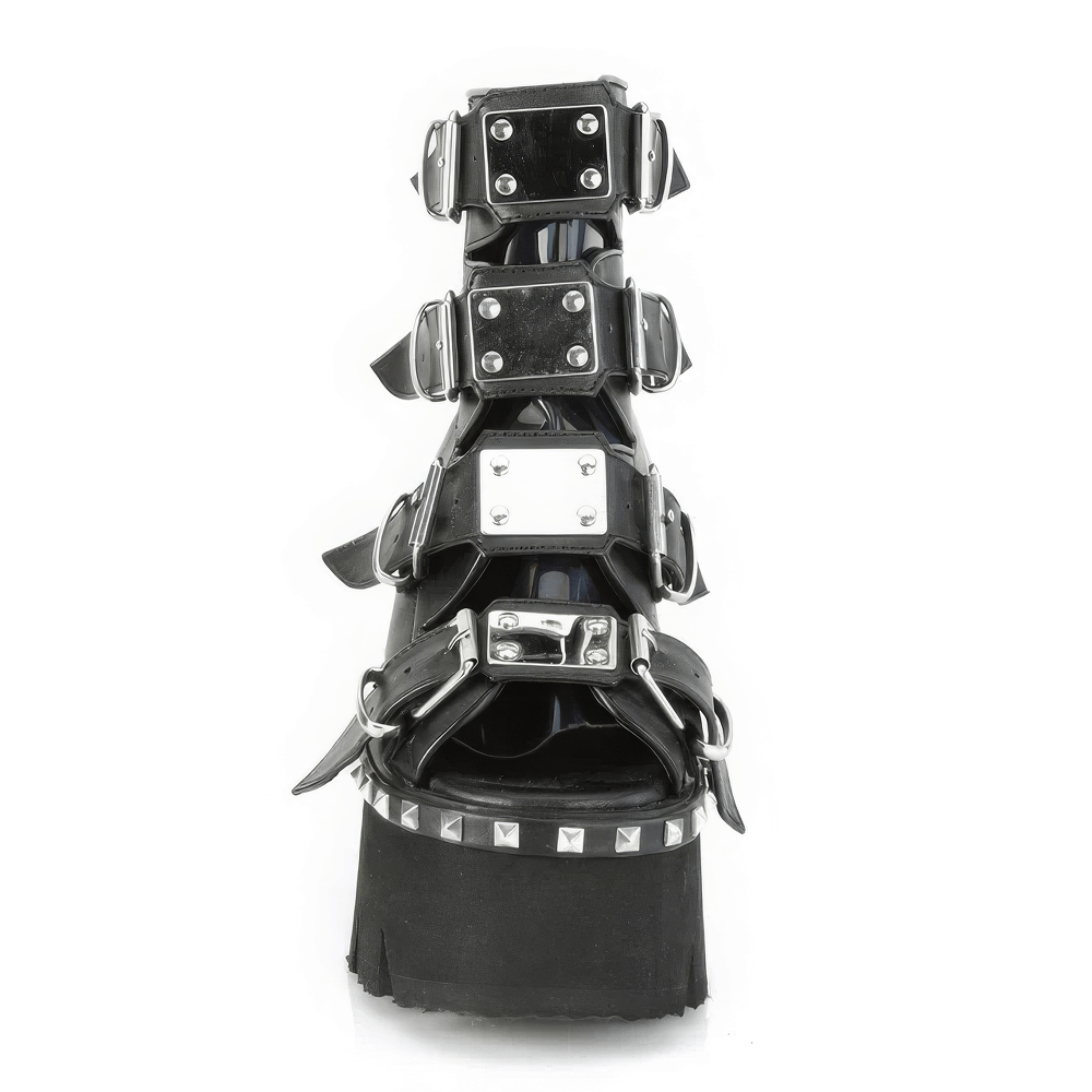 Demonia black chunky heel bootie sandals featuring buckle straps and metal studs for a bold fashion statement.