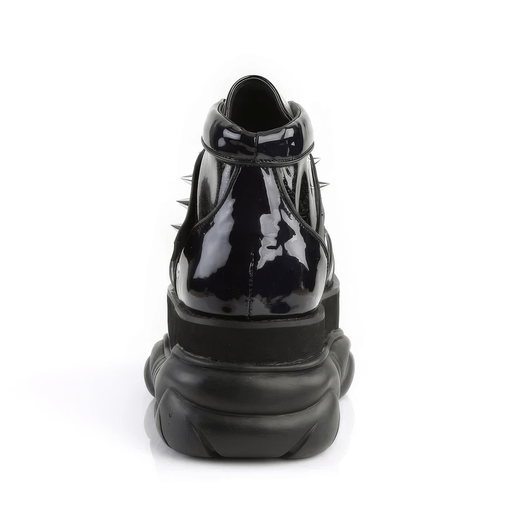 Back view of DEMONIA Black Glitter Platform Ankle Boots with sharp cone studs and glossy finish.