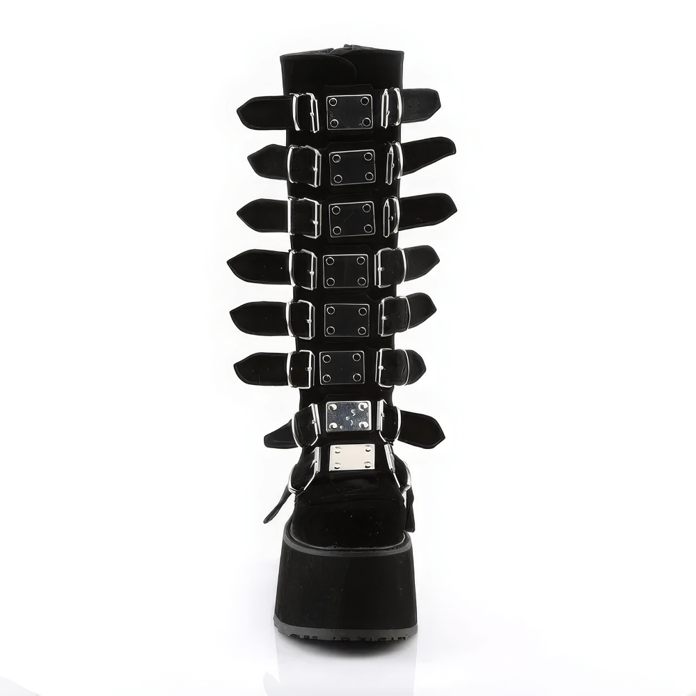 Daring black knee high boots featuring adjustable buckle straps and high platform for a bold, rebellious style.