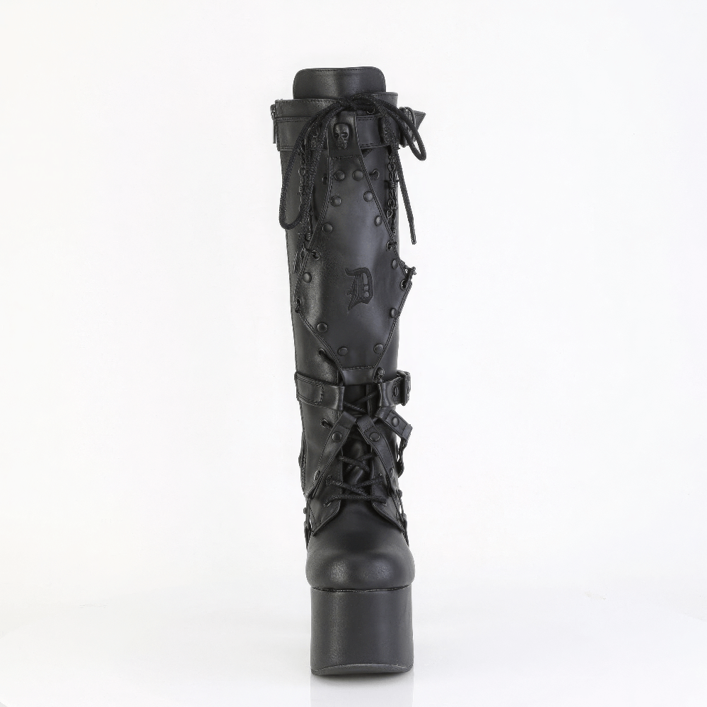 Gothic black knee high boots with harness and skull studs, featuring lace-up front and striking platform heel.