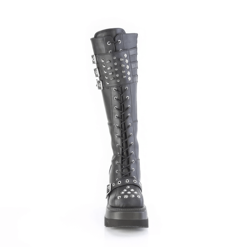 Demonia black knee-high lace-up boots with spiked shield and triple buckle design for a bold, edgy look.
