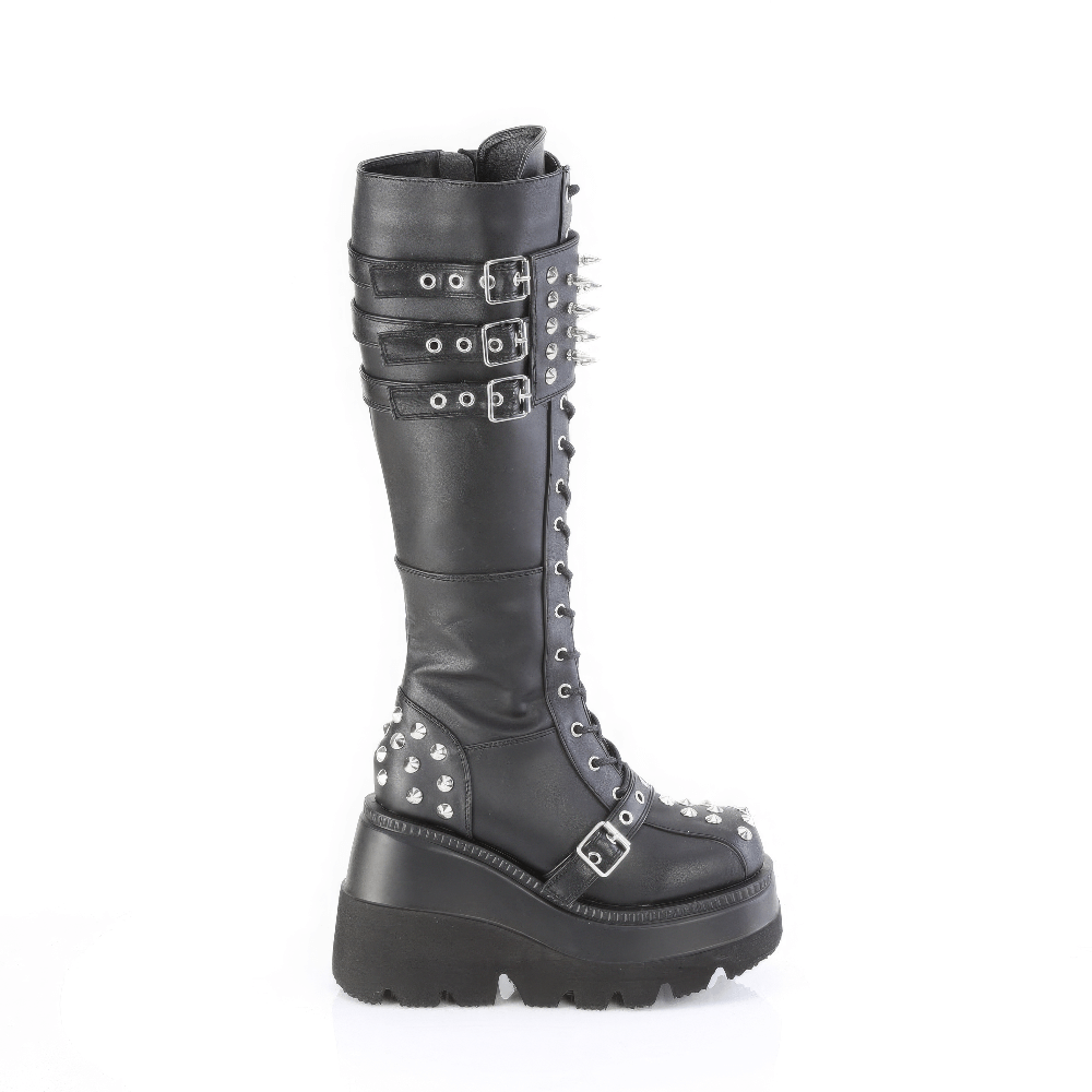 Demonia black knee-high lace-up boots with spikes and triple buckle design, ideal for bold fashion statements.