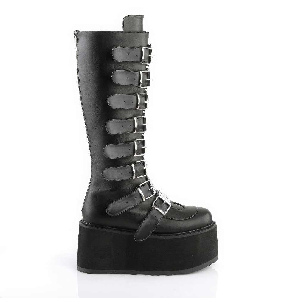 Demonia black knee-high platform boots with buckle straps, featuring chrome hardware and durable vegan leather.