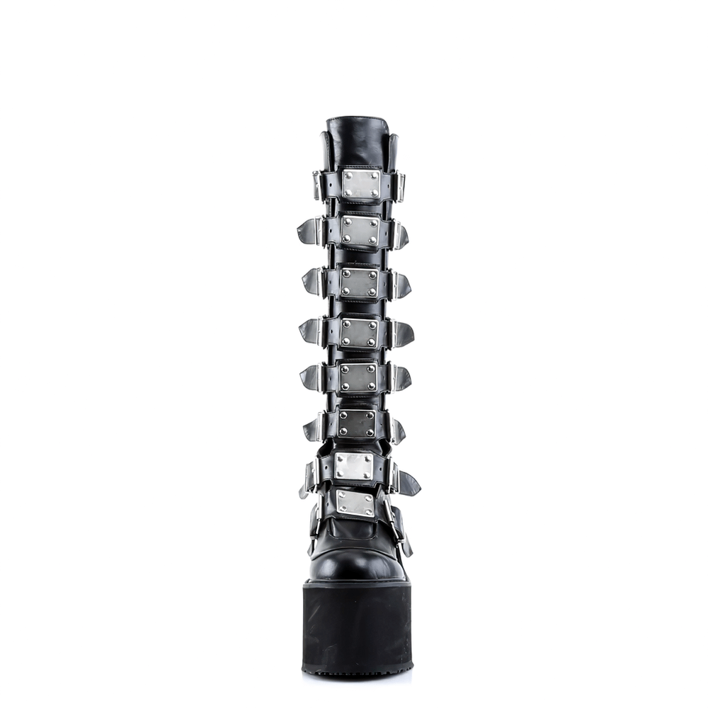 Demonia black knee-high platform boots featuring metal buckles and a 5.5-inch wedge, perfect for punk and goth styles.