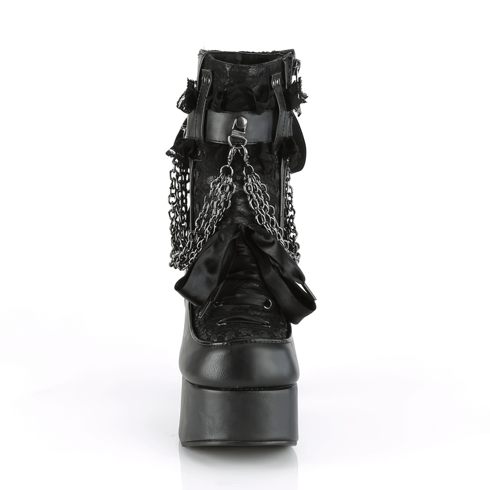 Demonia black lace ankle boots with chain and ribbon detail, featuring chunky block heel and edgy ruffled strap.