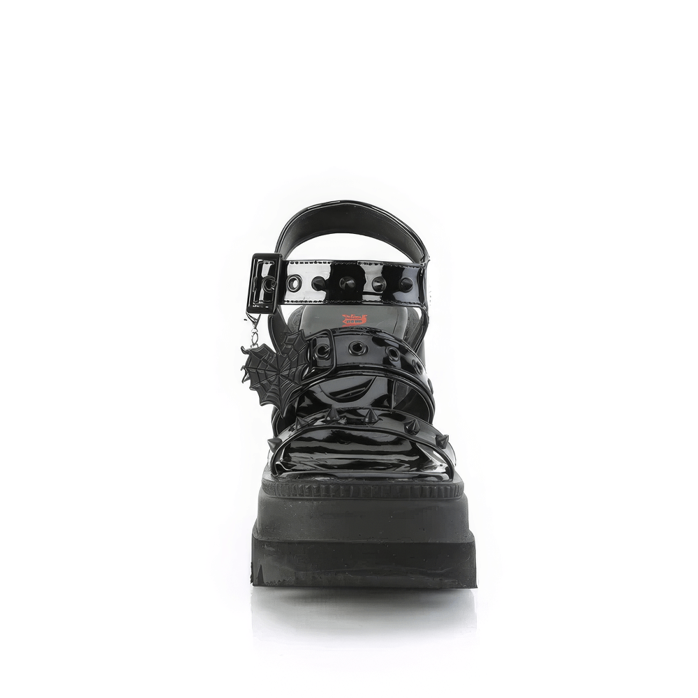 Demonia black patent platform sandals with cone studs and heart buckle charm, stylishly edgy footwear.