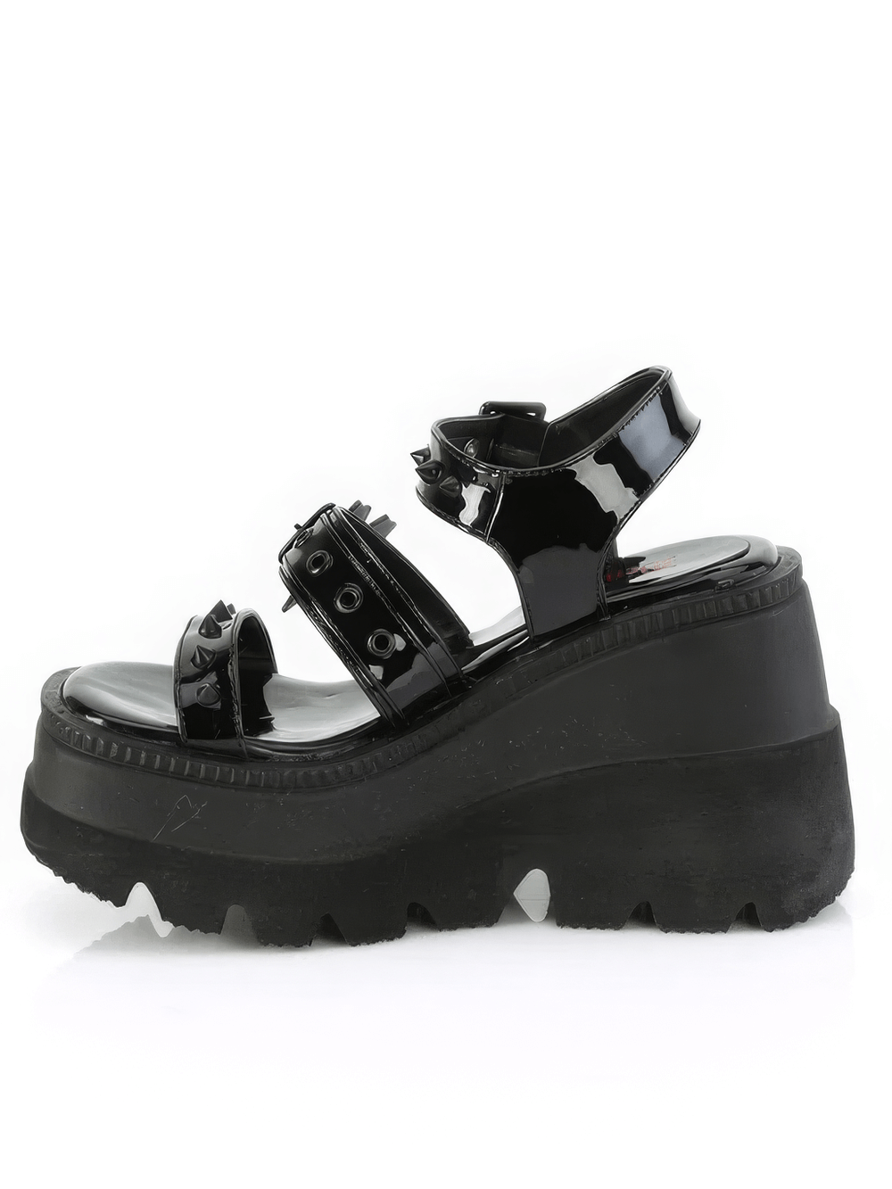 Demonia black patent platform sandals with cone-studded straps, a charming heart buckle, and bold platform design.