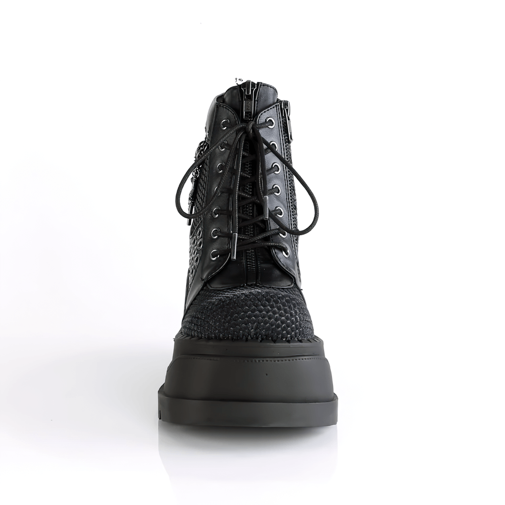 Daring DEMONIA black platform booties with lace-up design, fishnet overlay, and edgy zip detail, perfect for night outings.