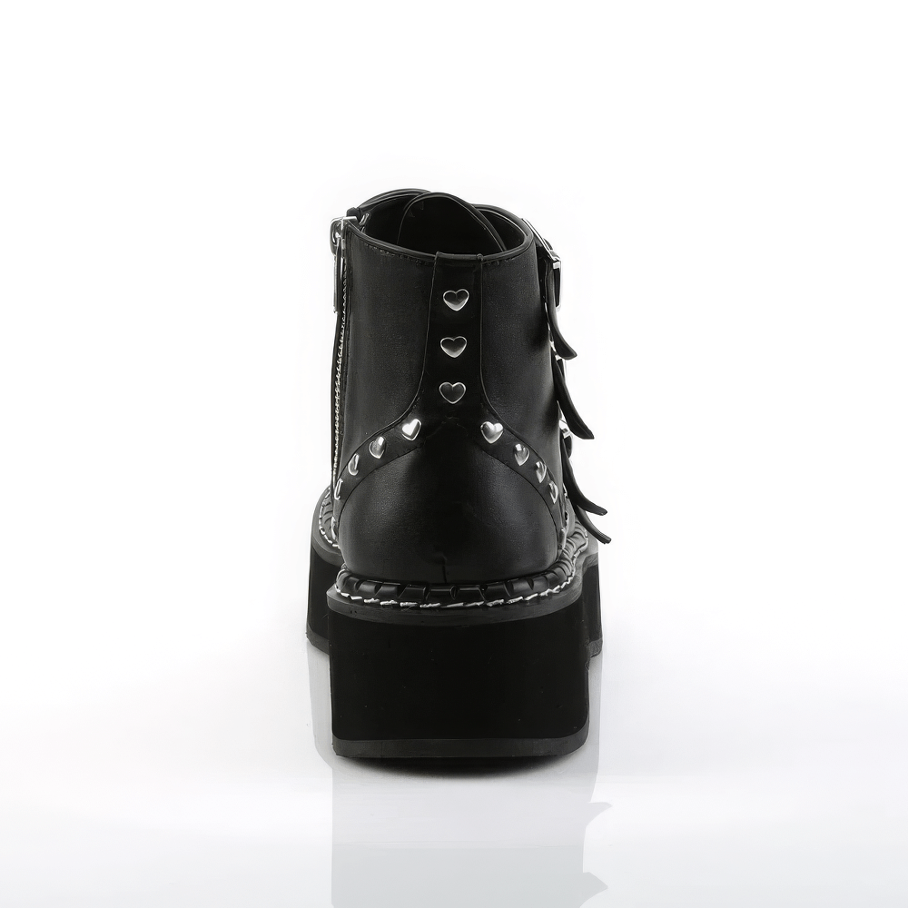 Back view of Demonia black platform boots with heart studs and buckle straps on a sleek, shiny background.