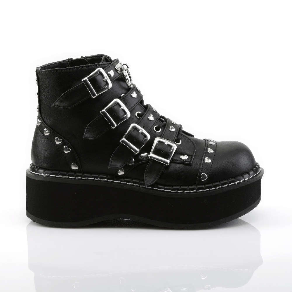 Demonia black platform buckle strap boots with heart studs and O-ring detail on a white background.