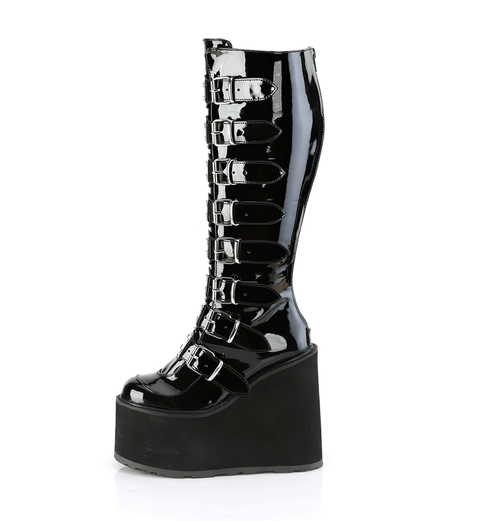 Demonia black platform knee-high boots with buckle straps for a bold, edgy look and wide calf design.