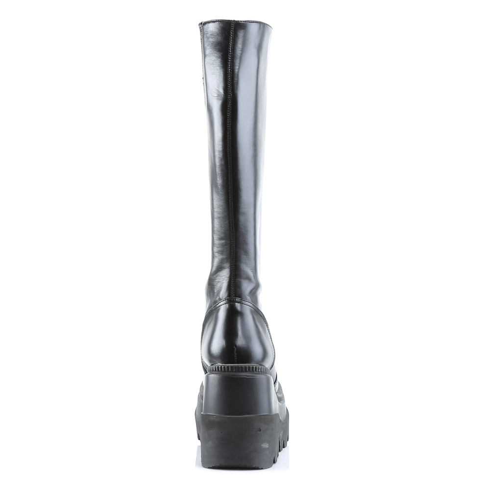 Back view of DEMONIA Black Stacked Wedge Platform Knee-High Boots with a sleek design and bold stacked wedge.