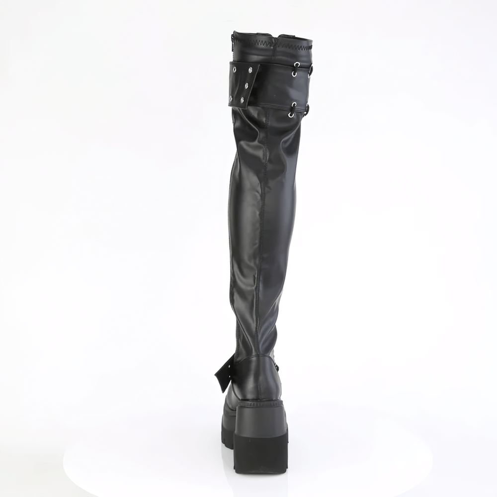 Black vegan leather thigh high boots with lace-up back and edgy straps, perfect for a bold fashion statement.