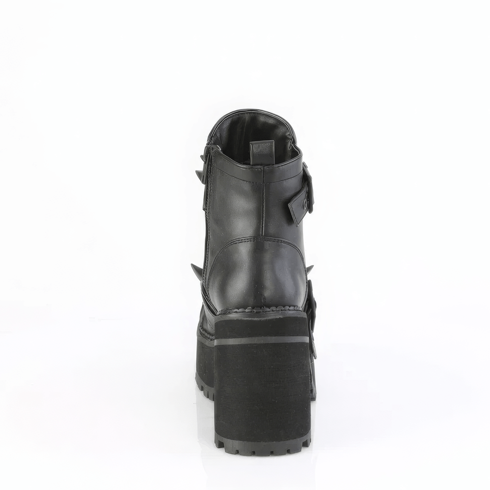 Back view of Demonia black studded ankle boots with towering block heel and cleated platform.