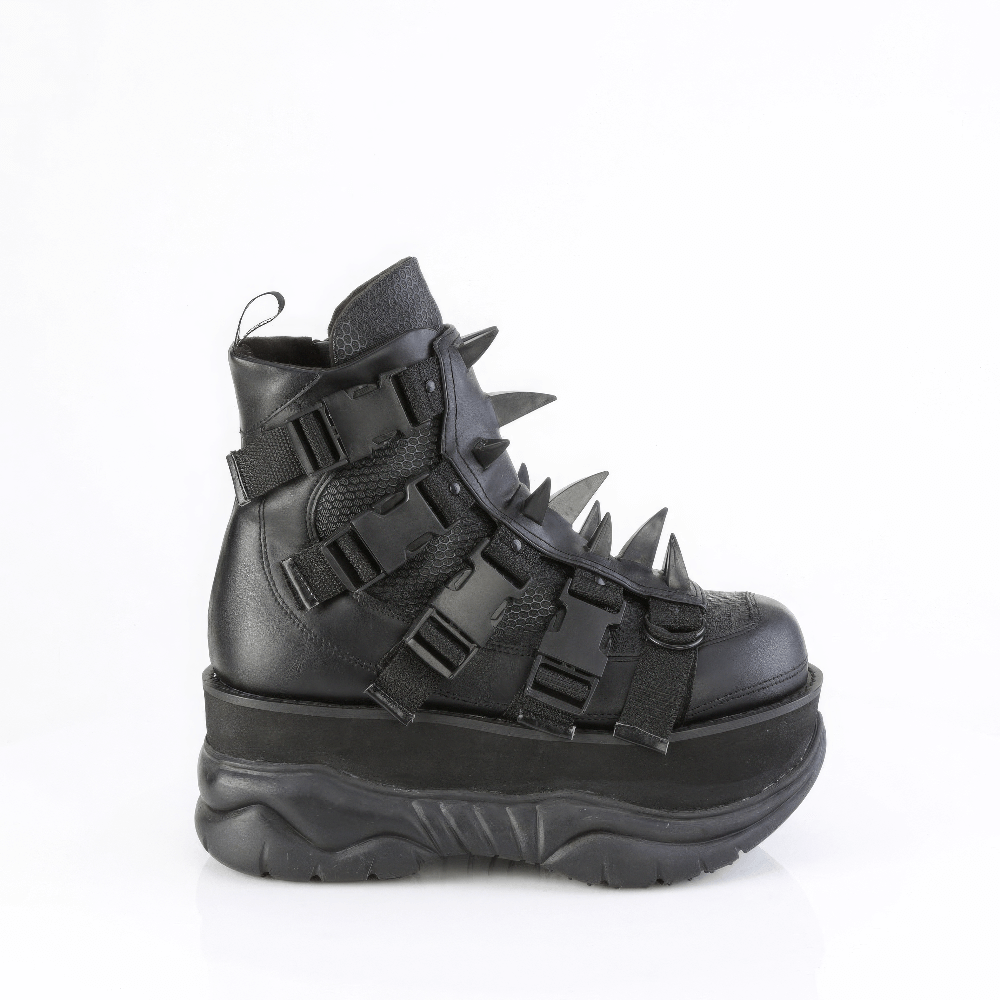 Demonia black studded shield platform ankle boot with claw spikes and buckle detailing, perfect for bold fashion statements.