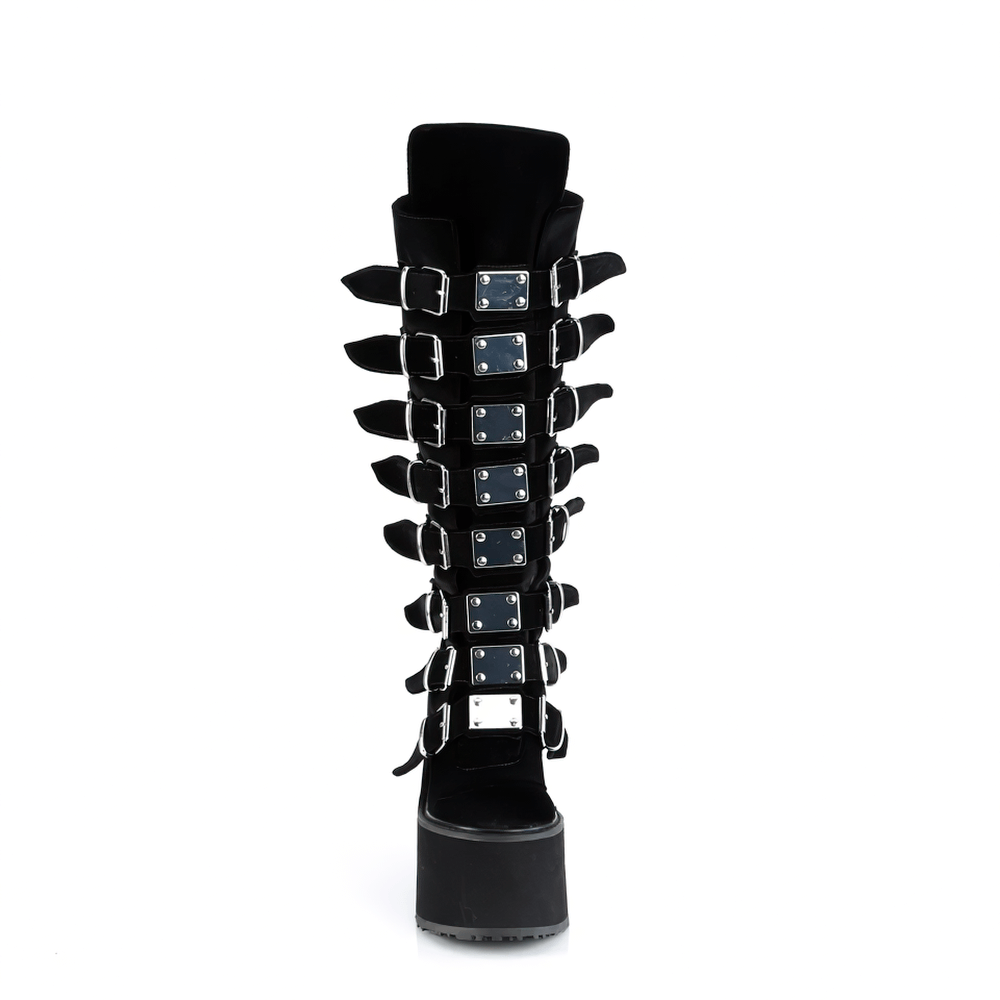 Demonia black velvet knee-high platform boots with bold buckle straps and metal plates, perfect for gothic style.