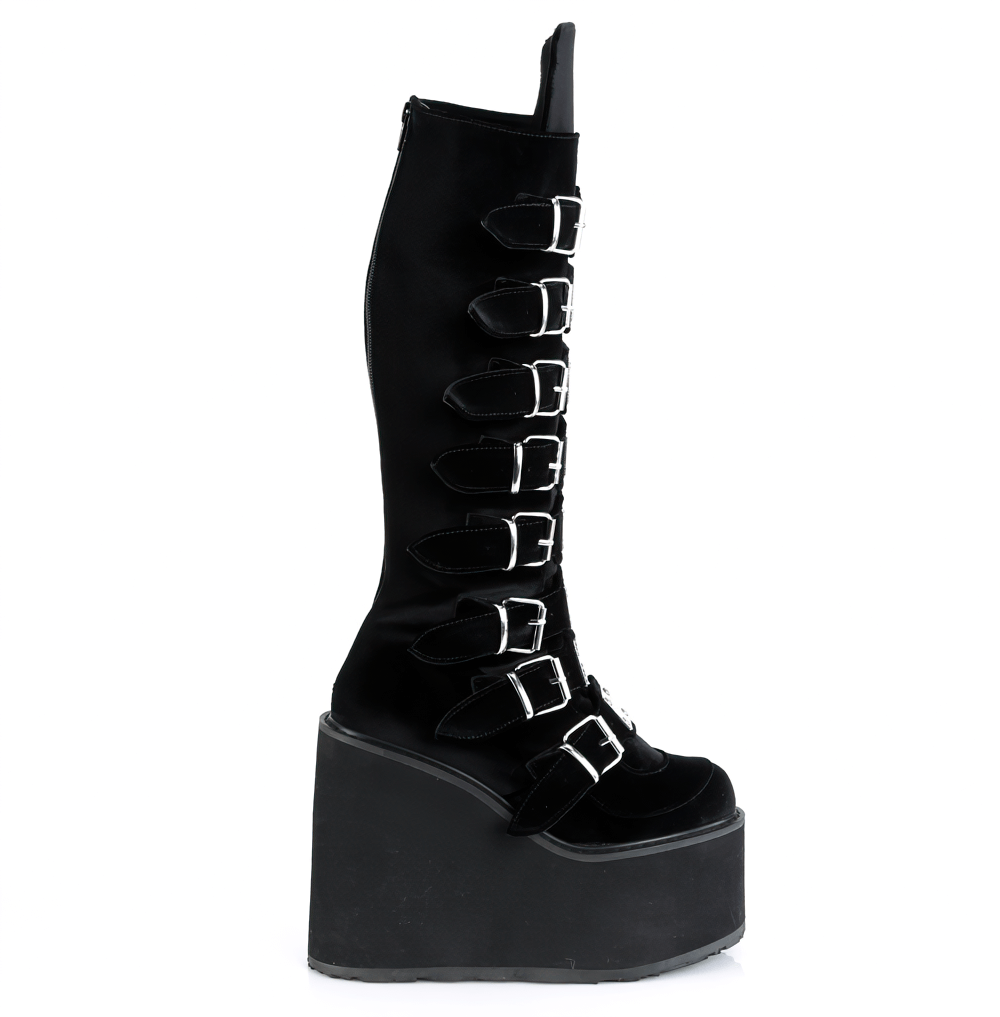 Demonia black velvet knee-high platform boots with buckles, showcasing a bold gothic style.