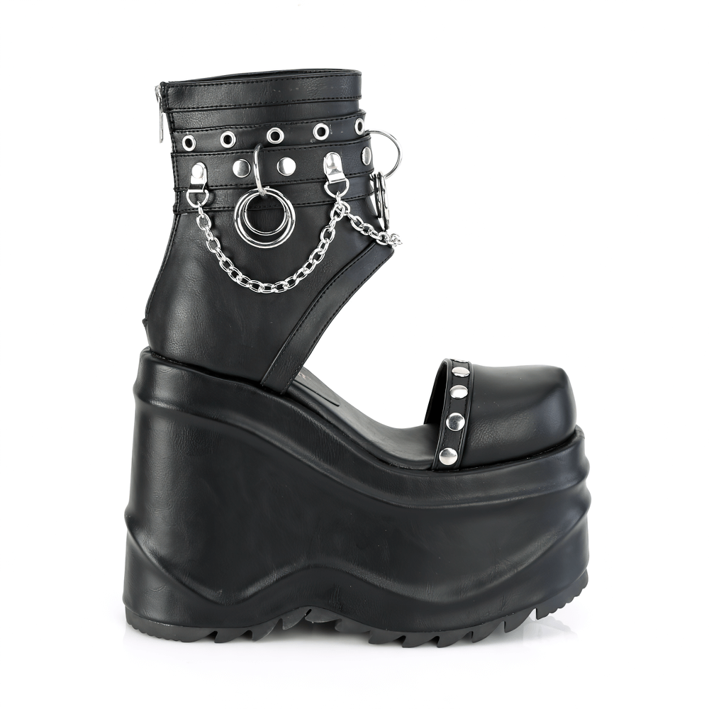 Demonia black wedge platform booties with chains and studs, featuring a 6-inch heel and back zip closure.
