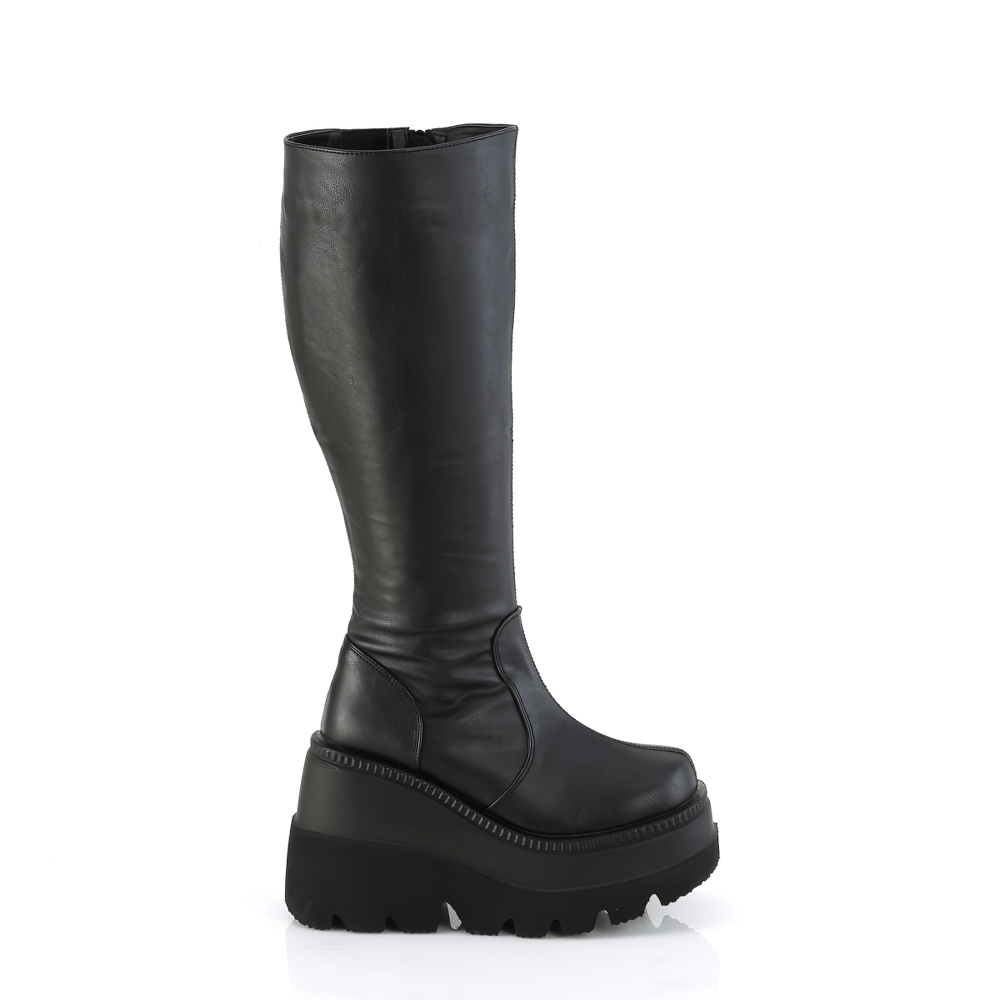 Demonia black wide calf knee-high wedge platform boots with 4.5-inch heel and zip closure.