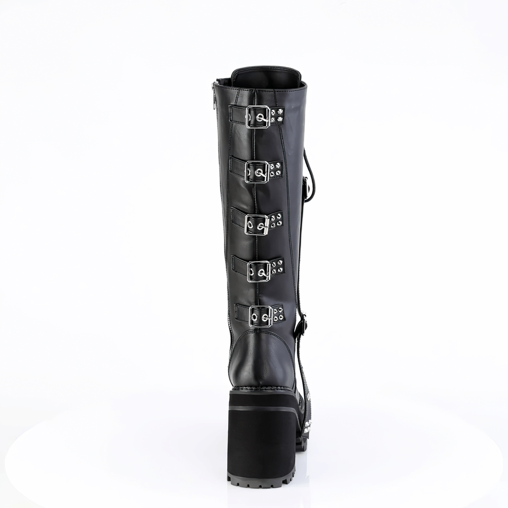 Back view of Demonia black knee high boots with spiked straps and silver buckles, showcasing bold block heel design.