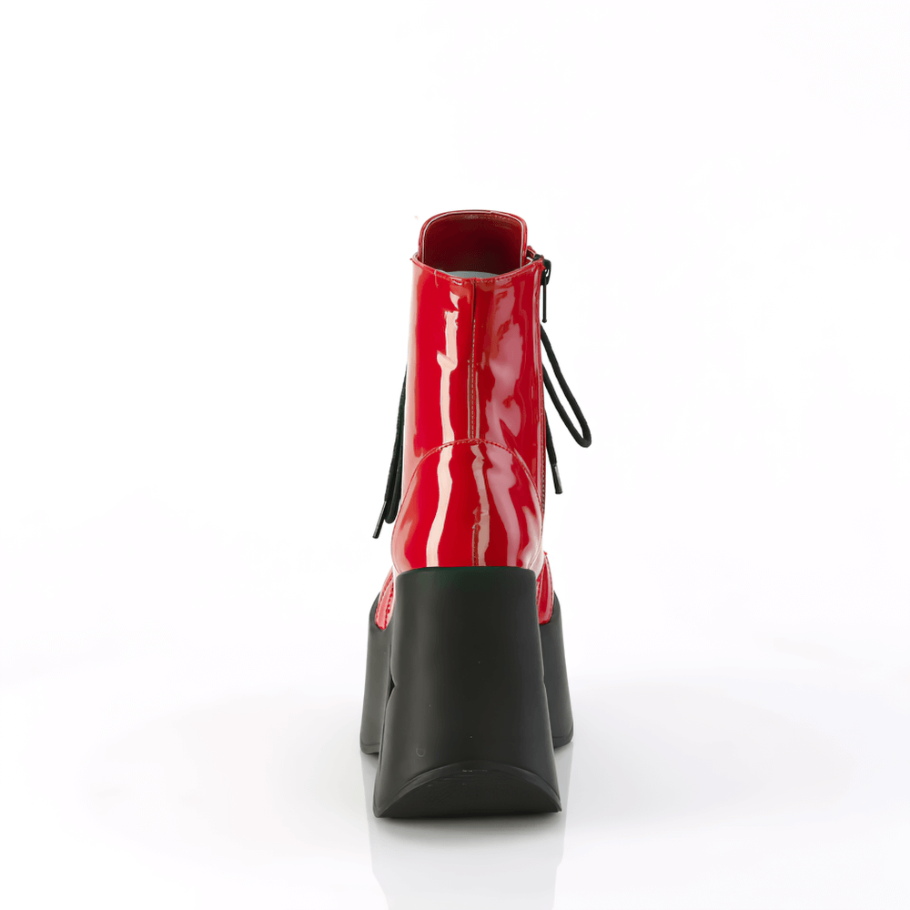 Bold red star platform wedge ankle boots with glossy finish and lace-up design, showcasing rear view with black heel.