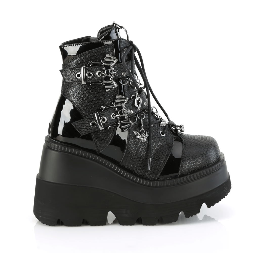 Demonia women's chained platform ankle boots with bat buckle details and stylish wedge platform.
