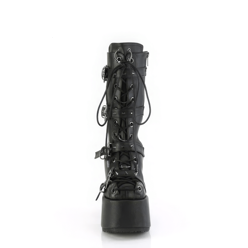 Dramatic Demonia mid-calf boots featuring corset lace-up, spiked skull buckle, and bold platform heel.