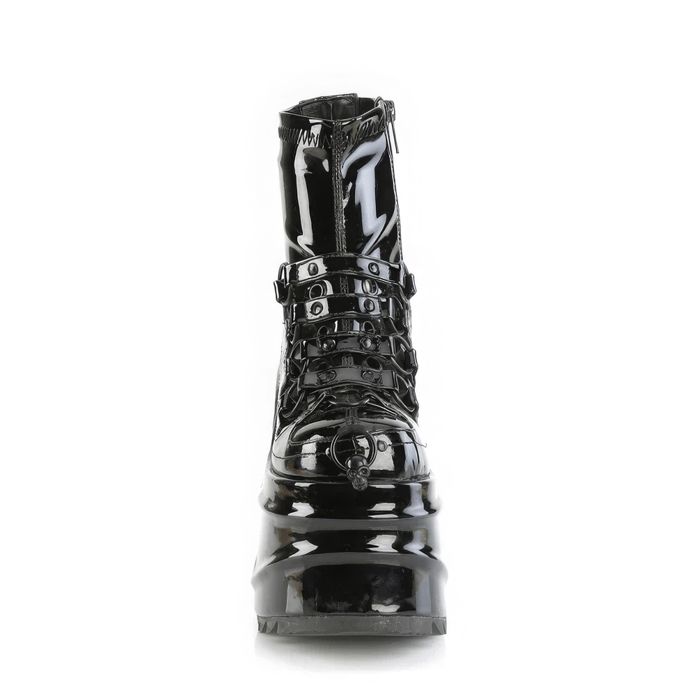 Demonia glossy black platform ankle boots with skull detail and studded accents, perfect for an edgy style statement.
