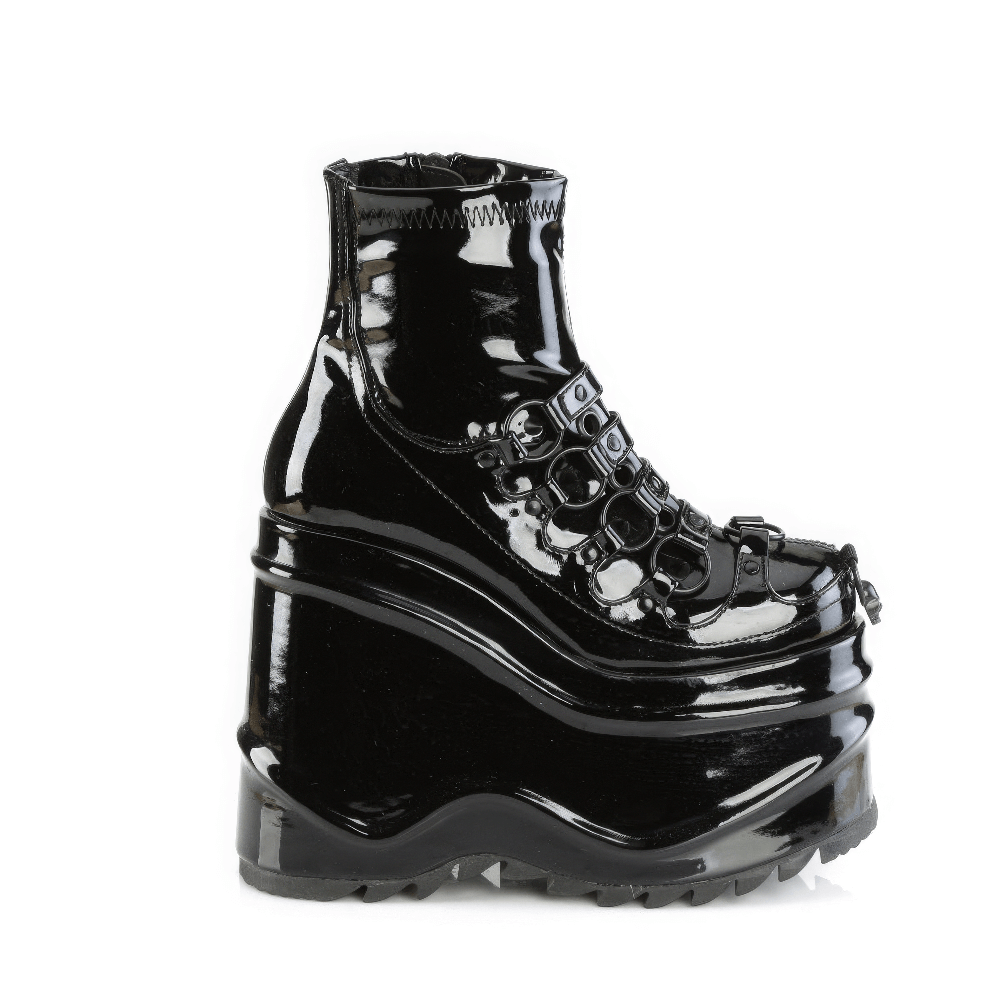 Demonia glossy black platform ankle boots with o-ring details and spike studs, showcasing edgy elegance.