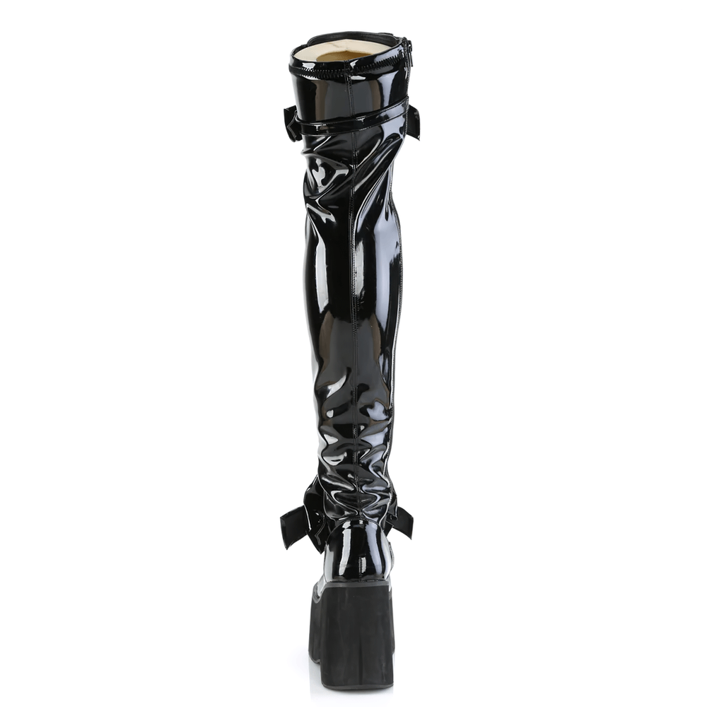 Daring glossy black thigh-high lace-up platform boots with oversized bows and adjustable straps from the back view.