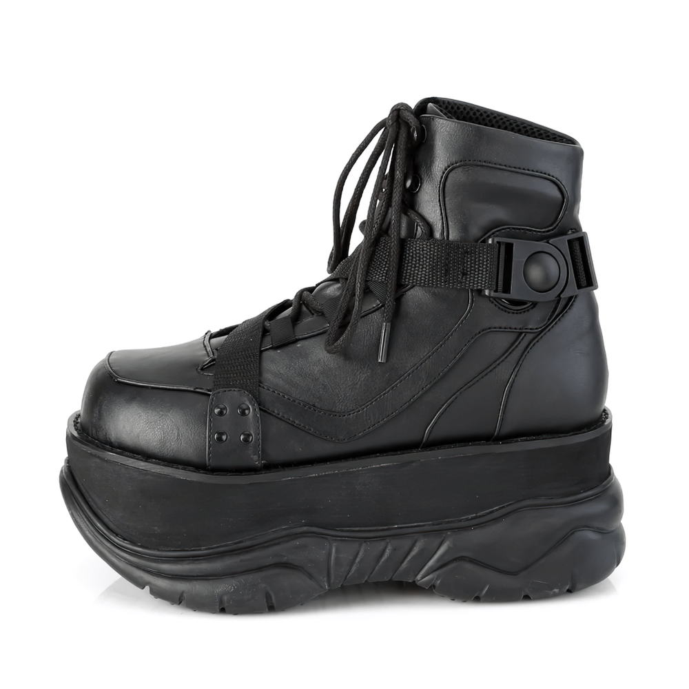 Demonia Gothic ankle boots in vegan leather with platform, lace-up design, and zig-zag strap detail.