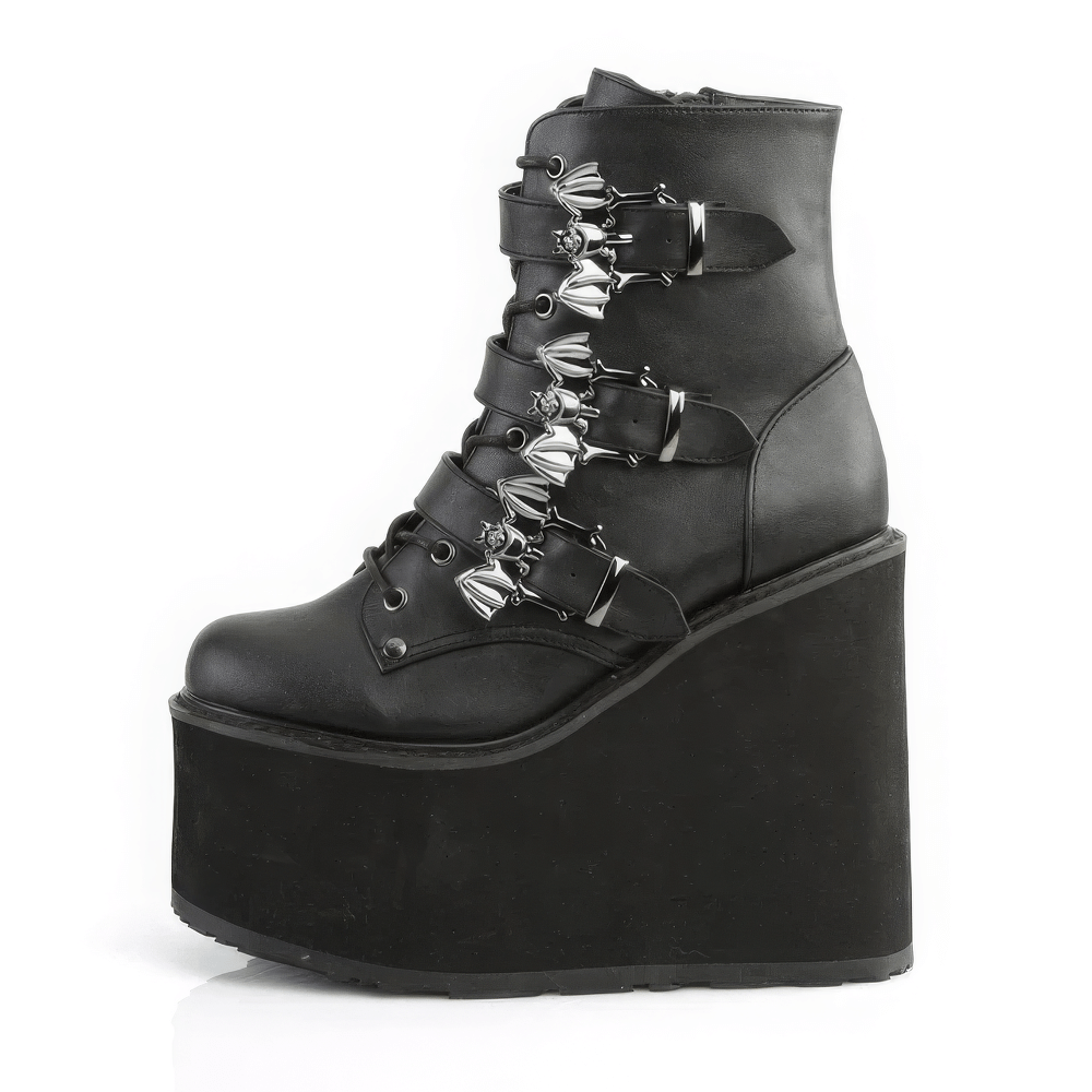 Demonia Gothic platform ankle boots featuring triple bat buckles and a bold 5.5-inch wedge heel.