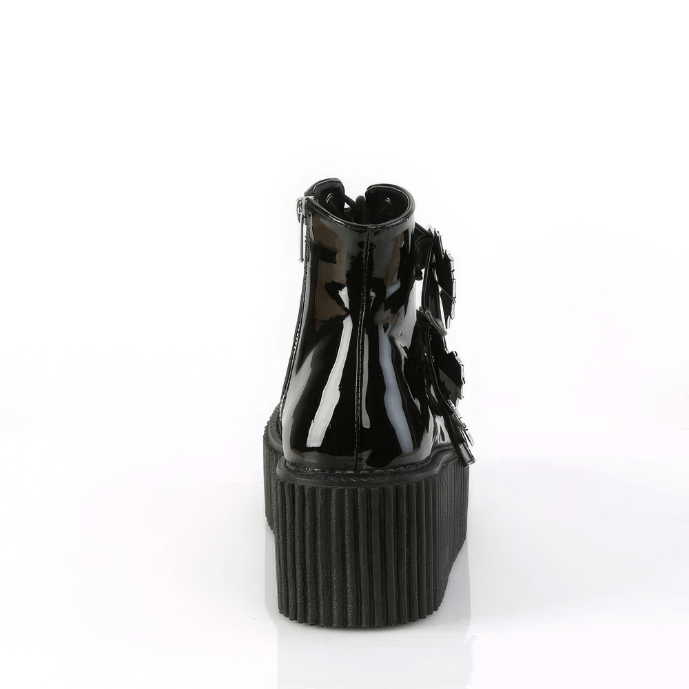 Back view of DEMONIA Gothic Spider Web Strap Platform Boots showcasing the sleek black patent finish and dramatic heel.