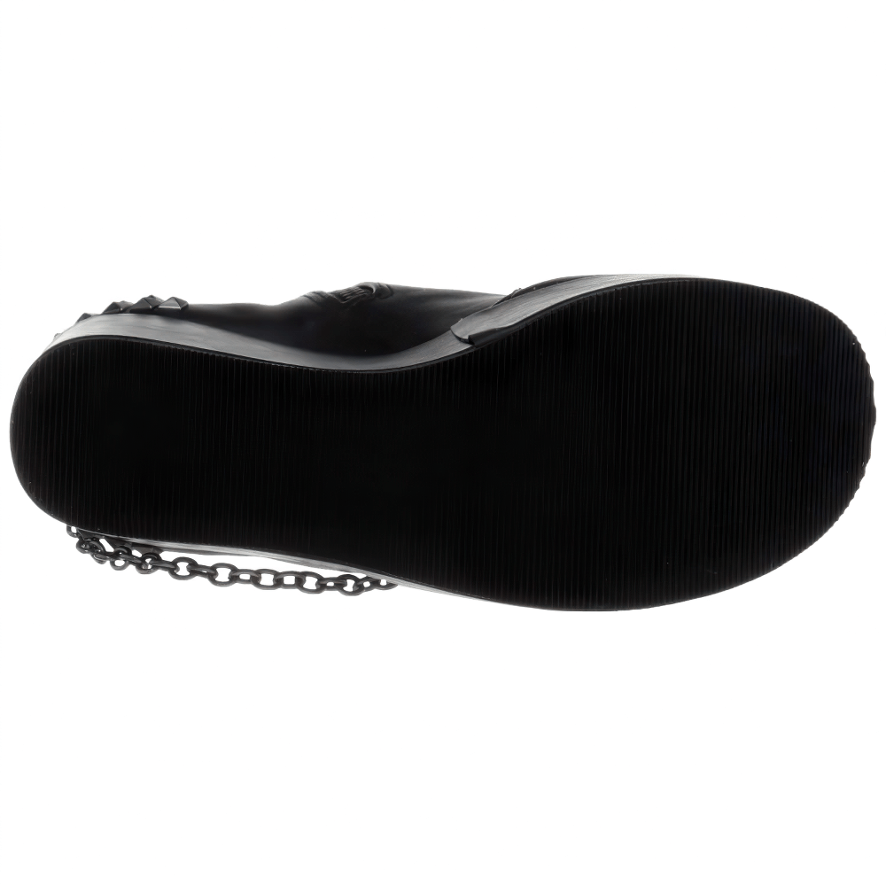 Bottom view of DEMONIA Gothic wedge platform boots with studded straps and pentagram detailing.