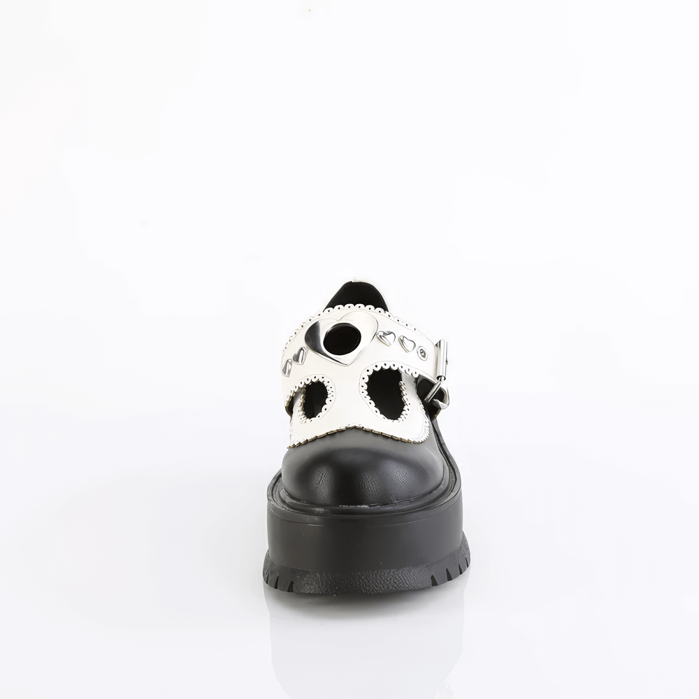 Front view of DEMONIA black and white T-Strap Mary Jane shoes with heart details and a chunky platform.