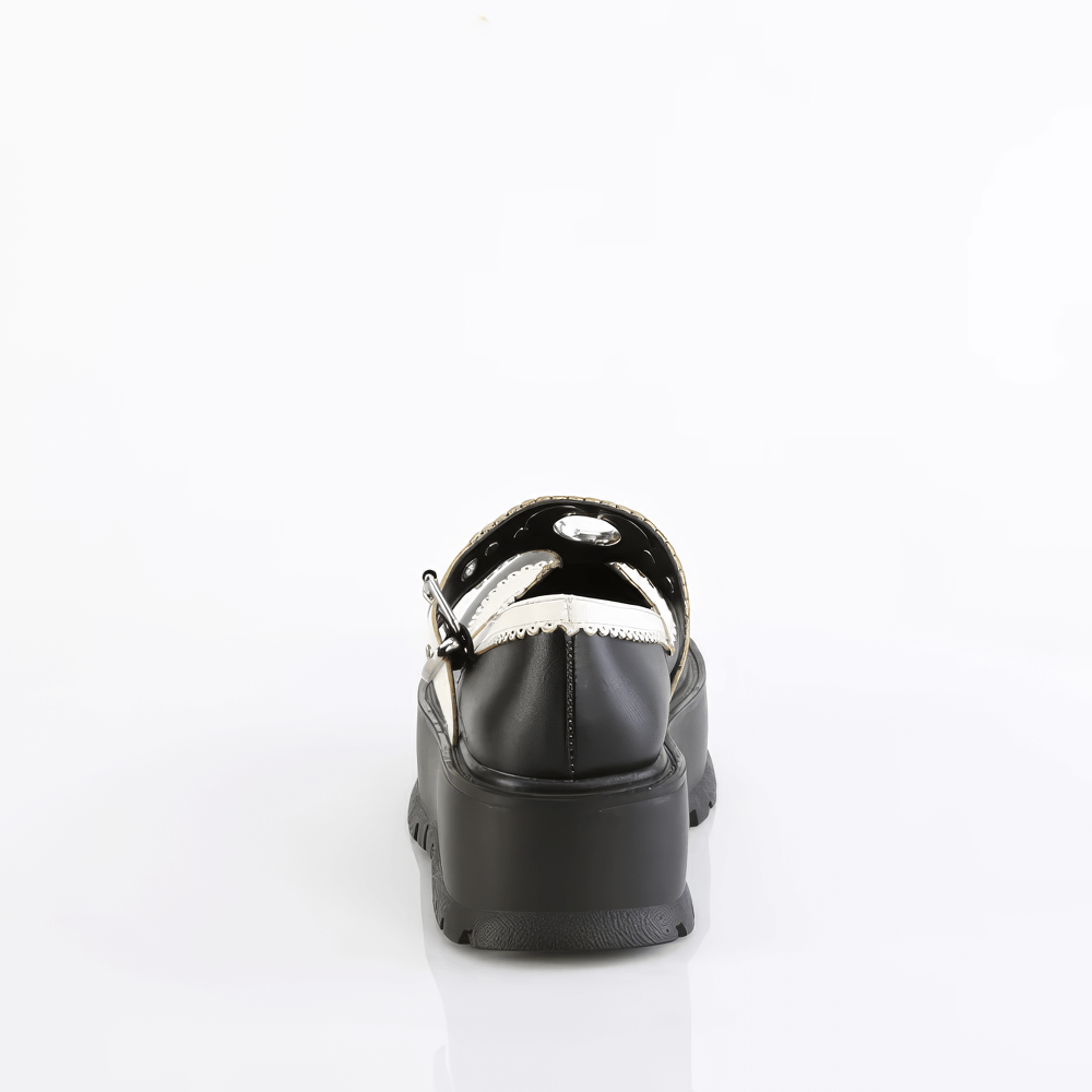 Back view of DEMONIA black Mary Jane shoes with heart details and scallop edges on a white background.